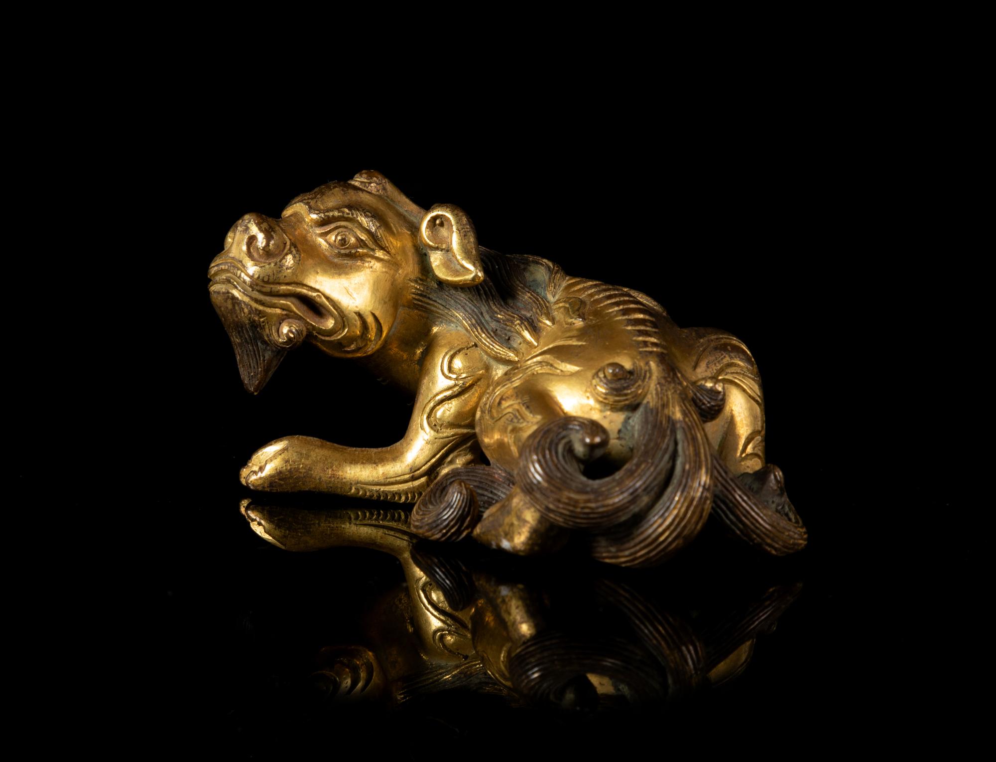 A Gilt Bronze Mythical Beast-Form Paper Weight
