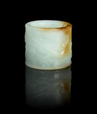 A Carved Jade Archer's Ring Diameter overall 1 1/4 inches.
