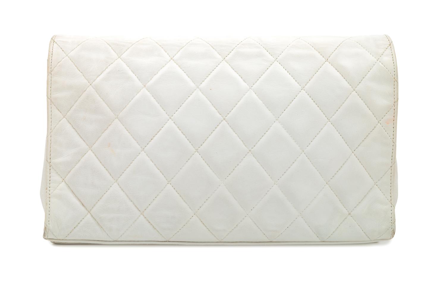 A Chanel White Lambskin Flap Clutch/Bag, 7" H x 10" W x 2" D; Strap drop: 17".