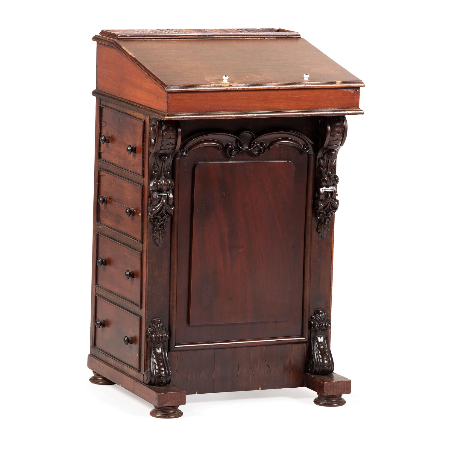 A Victorian Carved Mahogany Davenport Desk