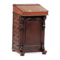 A Victorian Carved Mahogany Davenport Desk