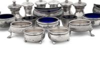 A Collection of Silver Pepper Mills and Salt Cellars