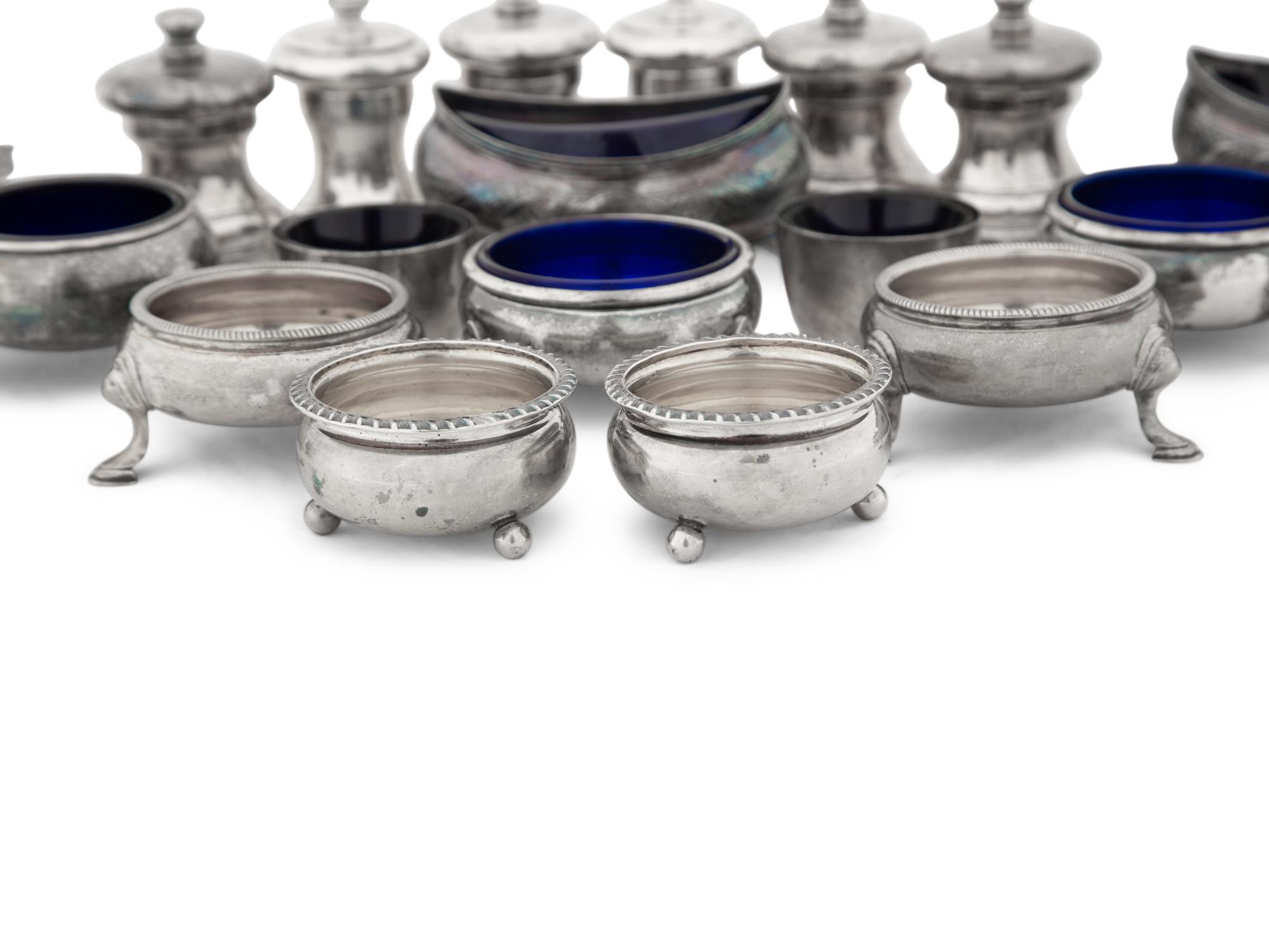 A Collection of Silver Pepper Mills and Salt Cellars