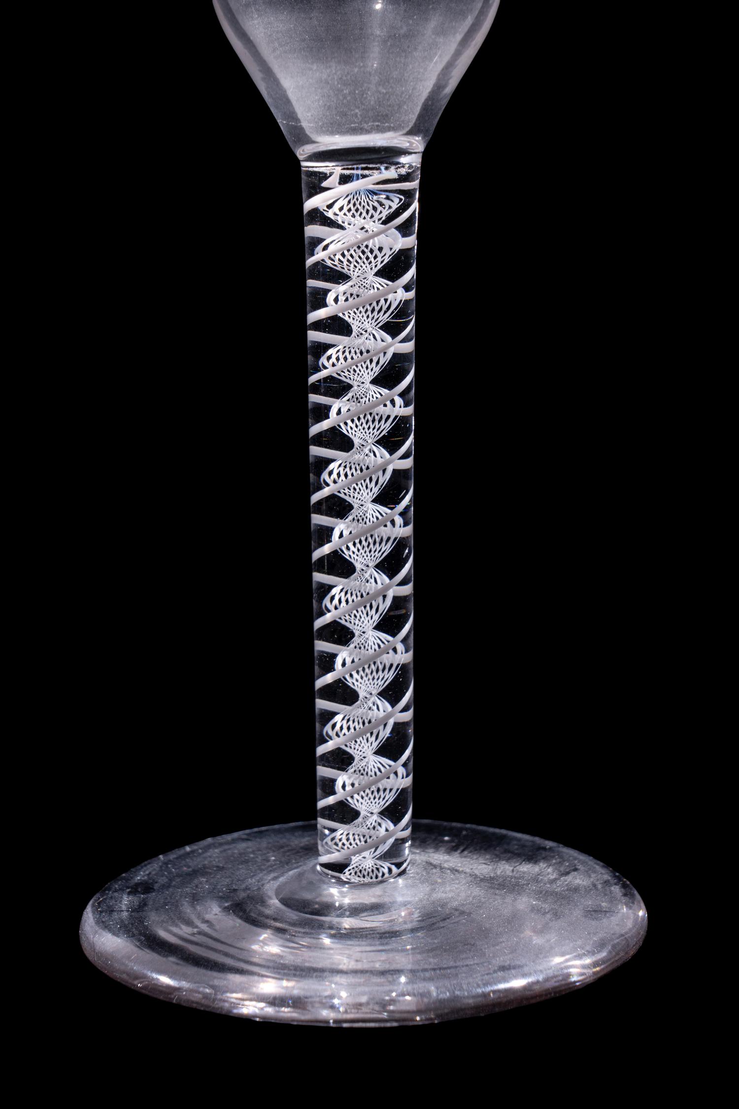 A Set of Seven Engraved Glass Cordials with Twist Stems