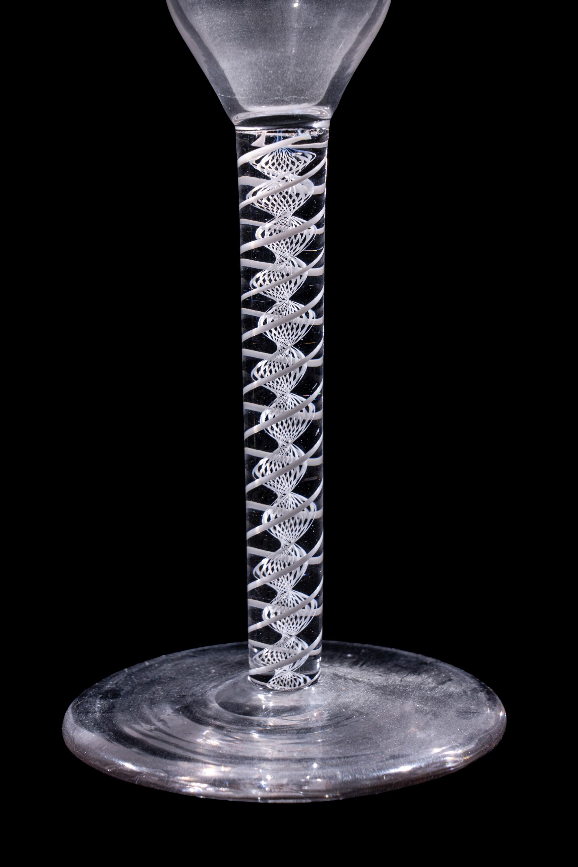 A Set of Seven Engraved Glass Cordials with Twist Stems