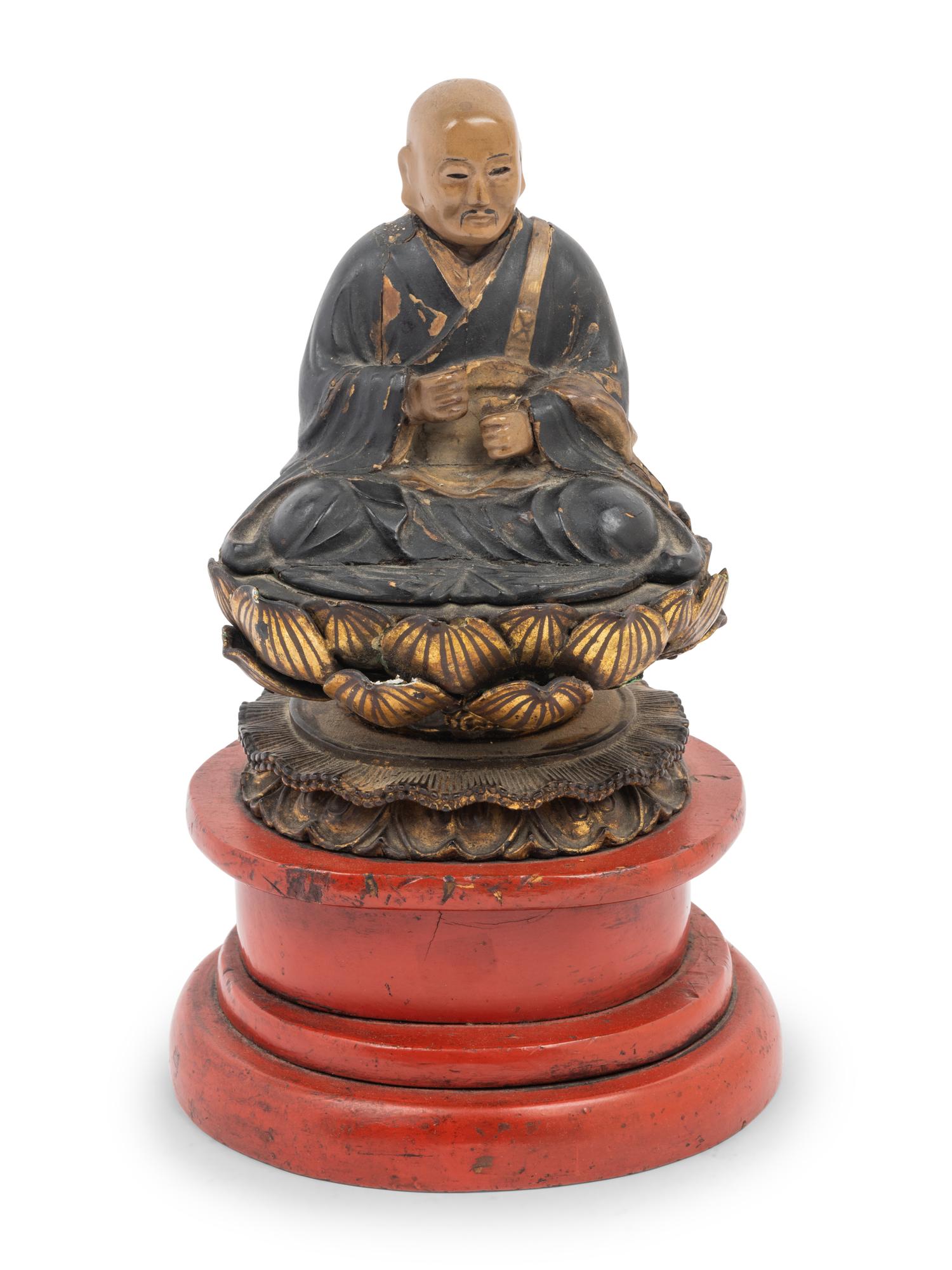 A Japanese Lacquered Wood Figure of a Seated Monk