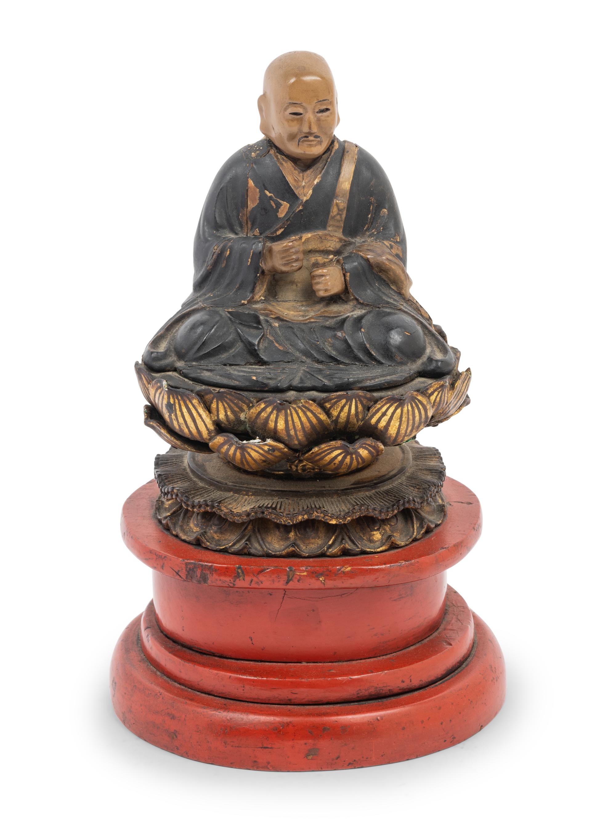 A Japanese Lacquered Wood Figure of a Seated Monk