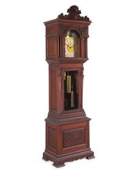A Renaissance Revival Carved Walnut Tall Case Clock