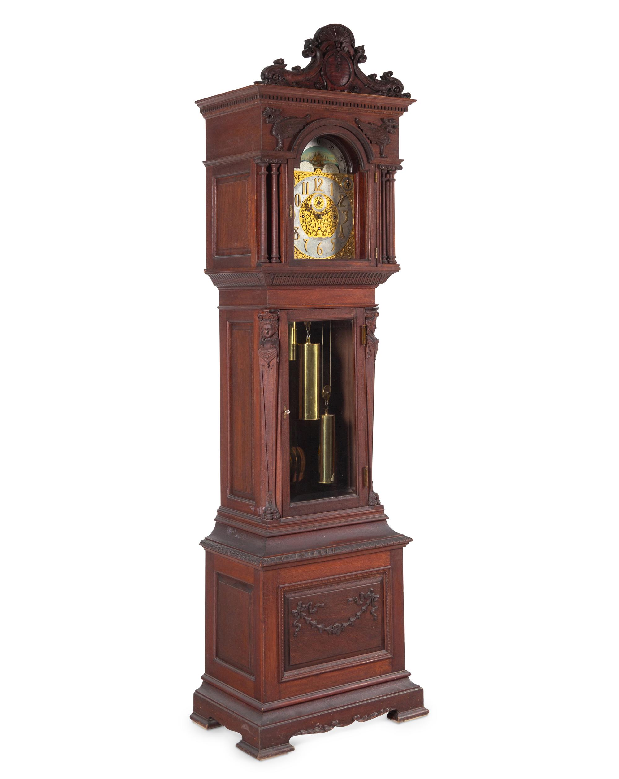 A Renaissance Revival Carved Walnut Tall Case Clock