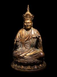 A Tibetan Gilt Bronze Figure of a Seated Guru