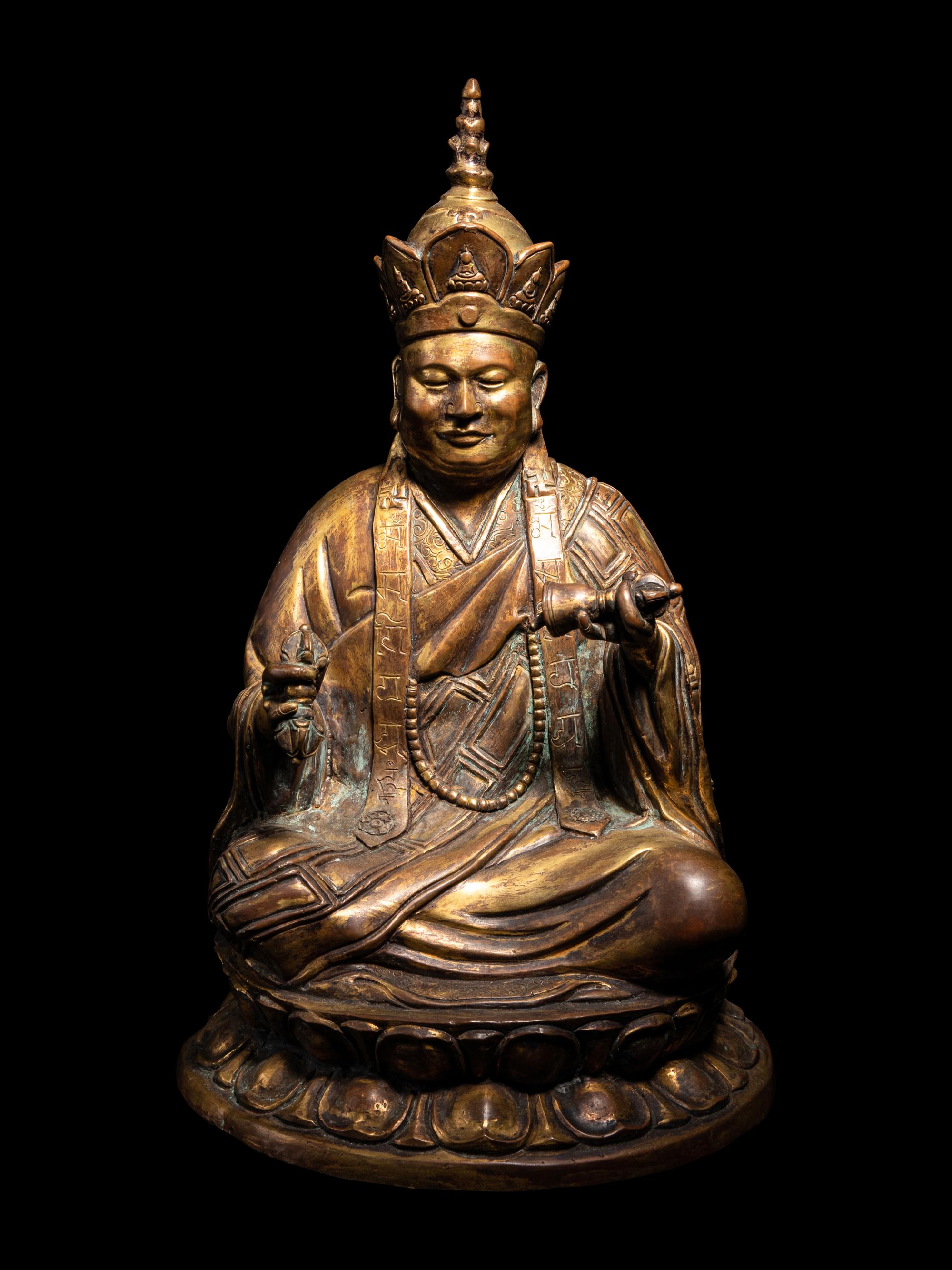A Tibetan Gilt Bronze Figure of a Seated Guru