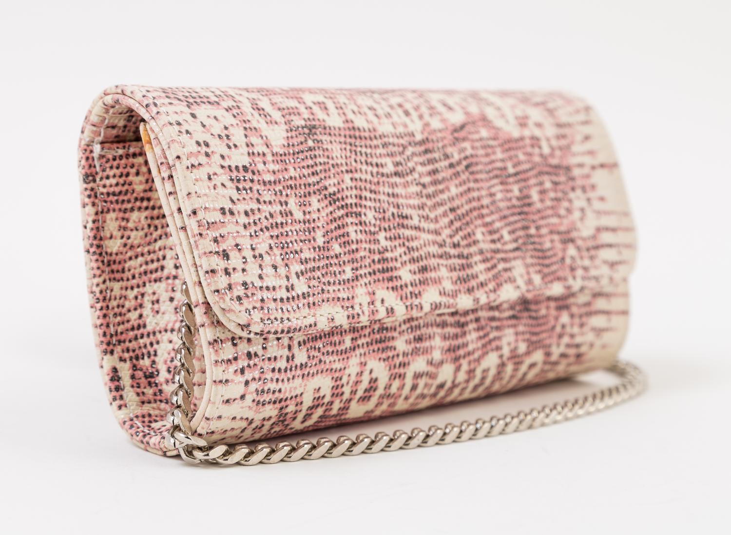 A Carlos Falchi Pink and Cream Snakeskin Clutch, 6.5" x 4" x 1.5".