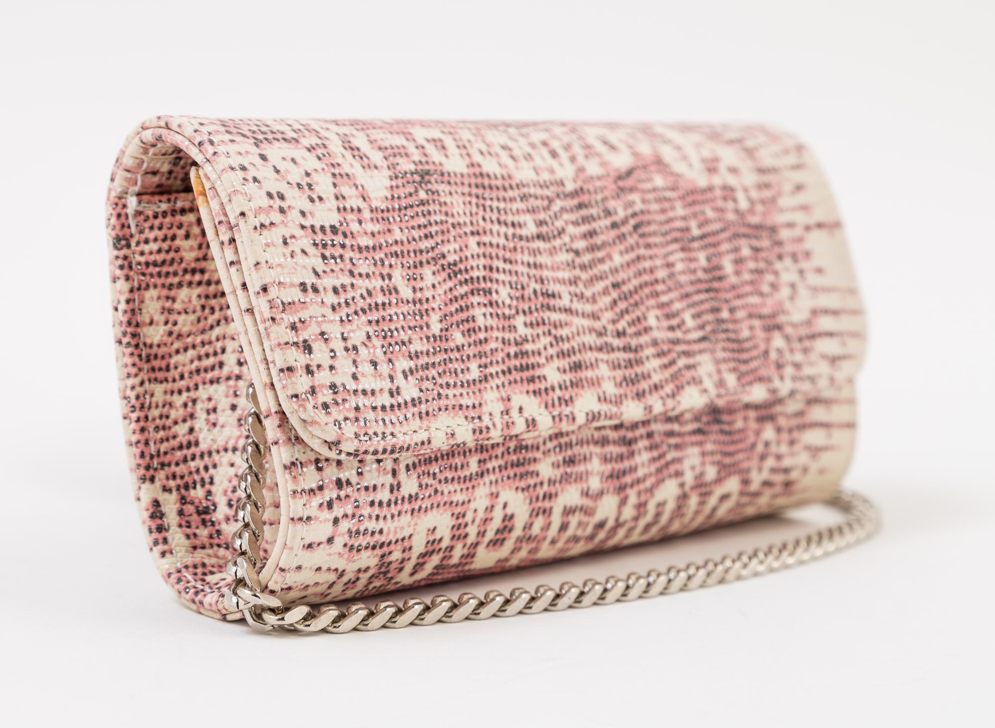 A Carlos Falchi Pink and Cream Snakeskin Clutch, 6.5" x 4" x 1.5".