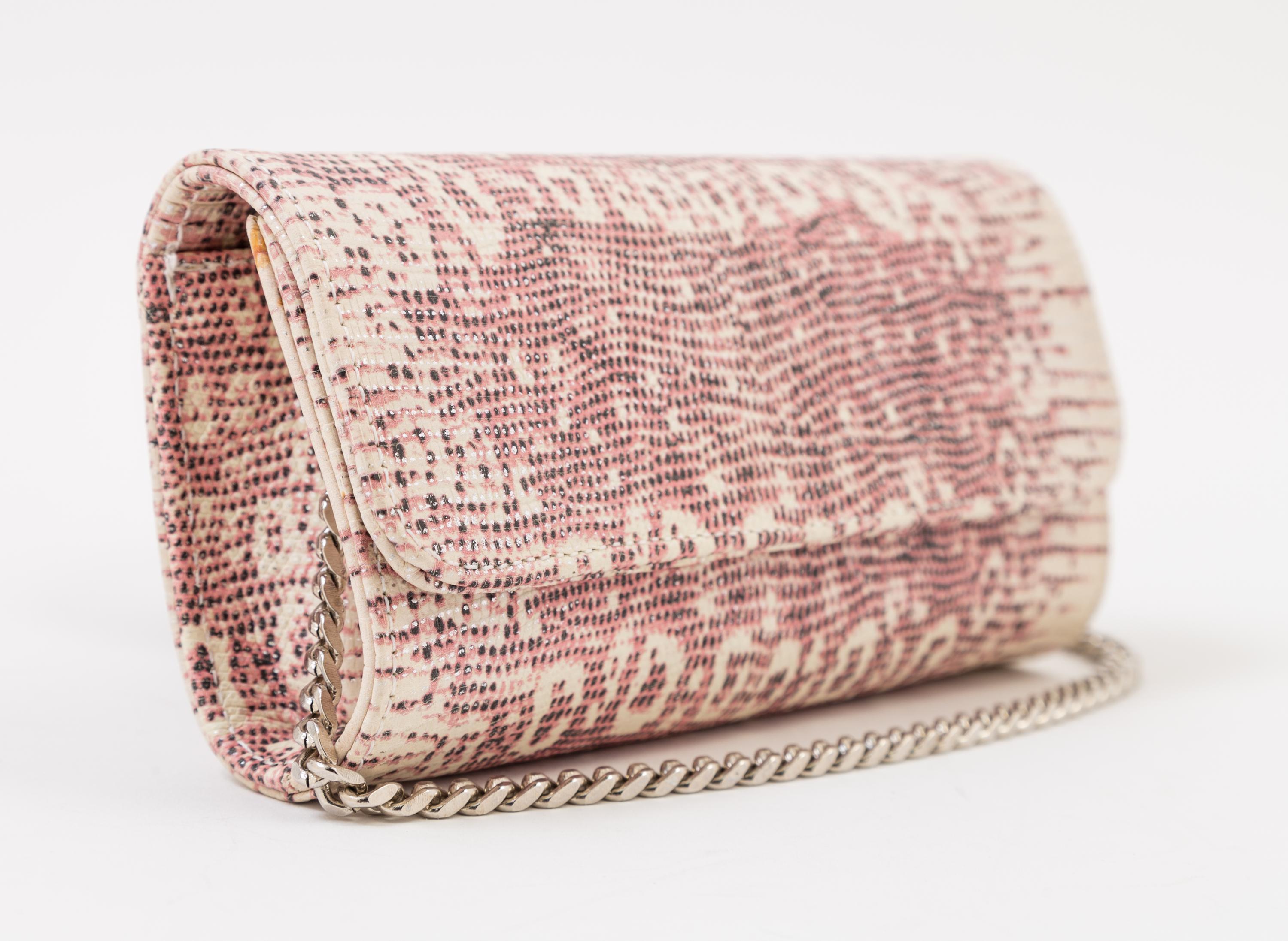 A Carlos Falchi Pink and Cream Snakeskin Clutch, 6.5" x 4" x 1.5".