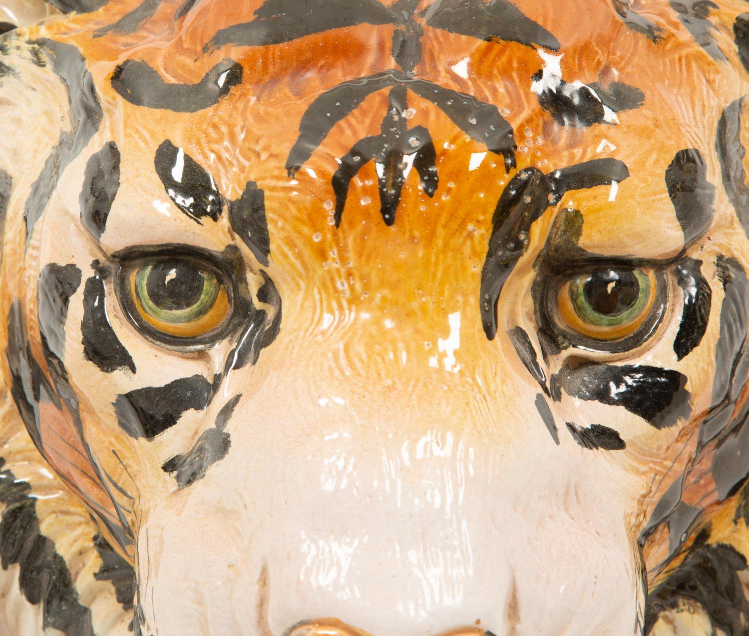 A Group of Six Italian Glazed Terracotta Feline Head Wall Mounts