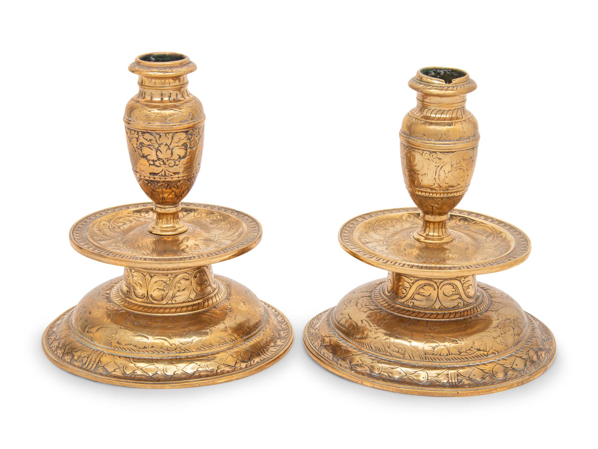 A Pair of Venetian Gilt Bronze Candlesticks
