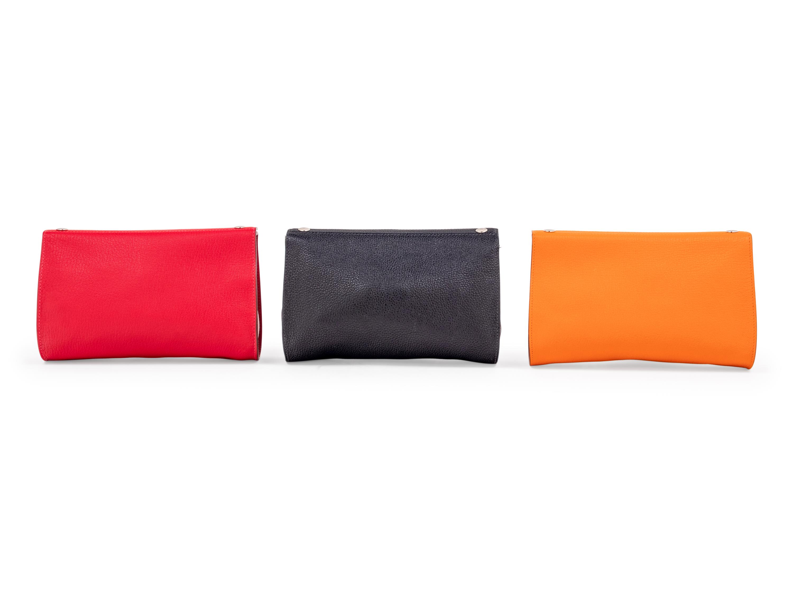 Three Hermès Leather Karo Trousse Cosmetic Bags, 2000-2013