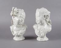 A Pair of Nymphenburg Blanc de Chine Busts of Children, Height 10 1/4 inches.