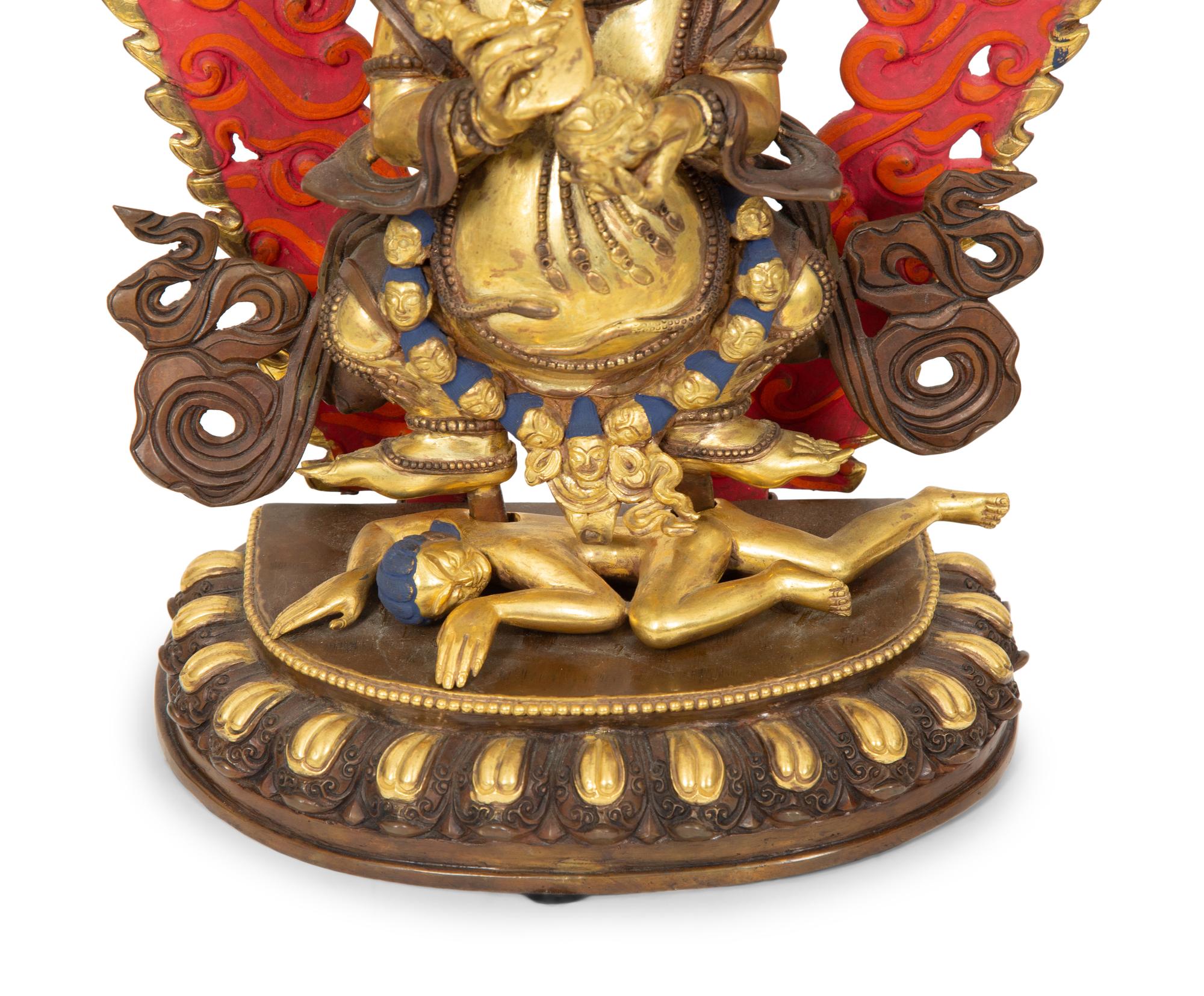 A Group of Three Tibetan Polychromed Brass Deities