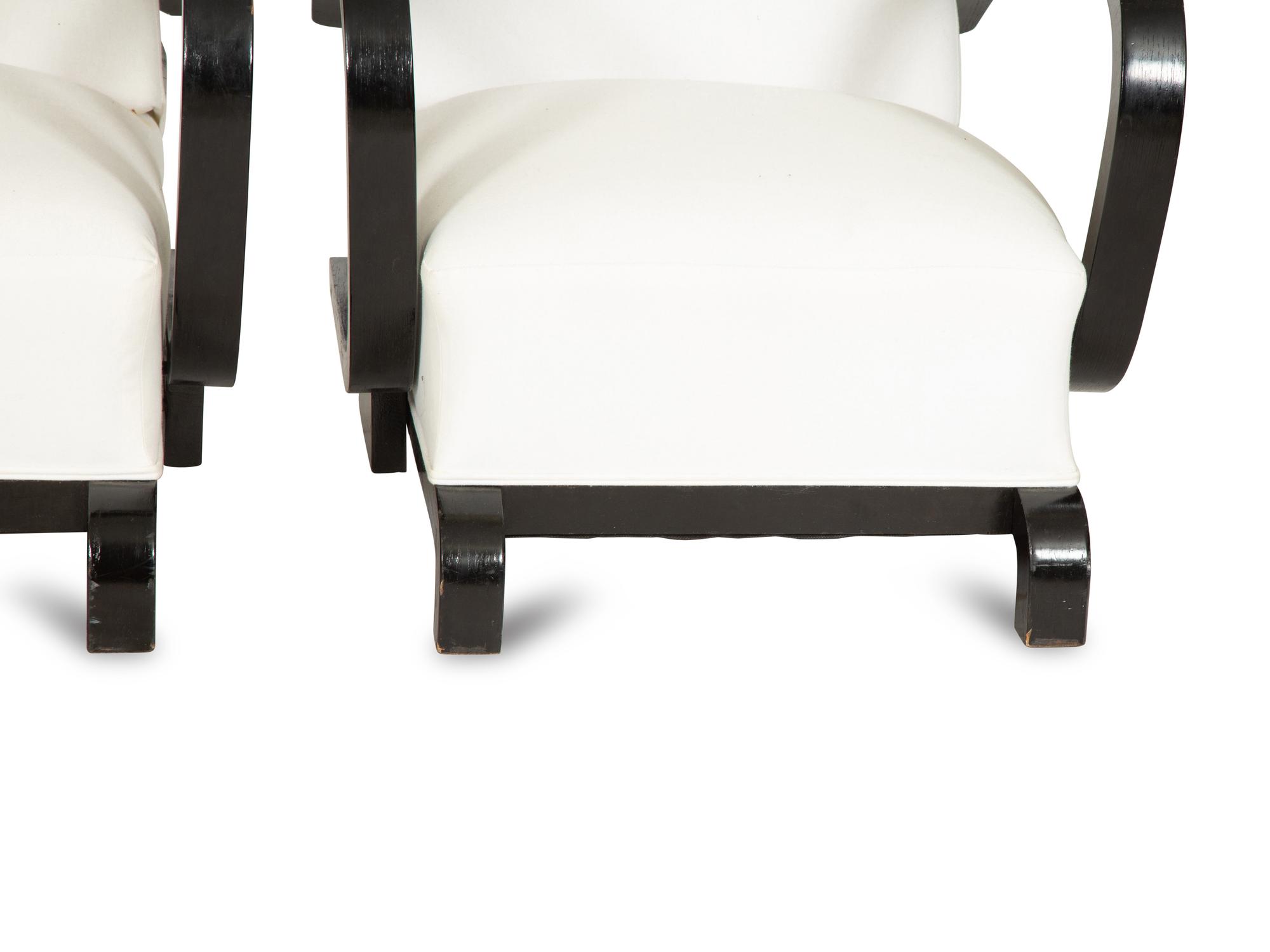 A Pair of Ebonized Oak Lounge Chairs