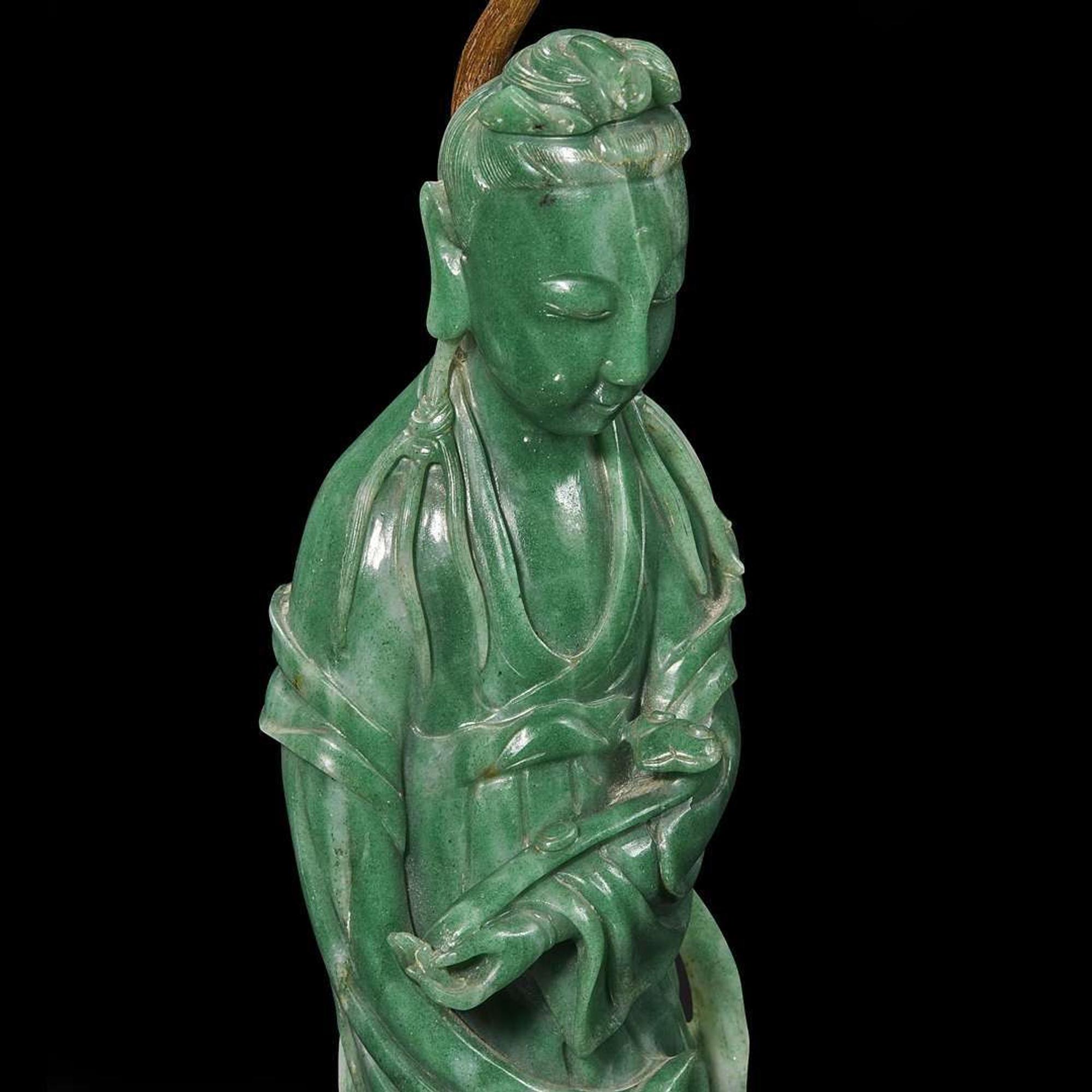 A Chinese carved green aventurine quartz Guanyin, mounted as a lamp 东陵石雕观音