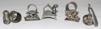 Five Silver-Plate Figural Napkin Rings Height of tallest 3 1/8 inches. — LATE 19TH CENTURY
