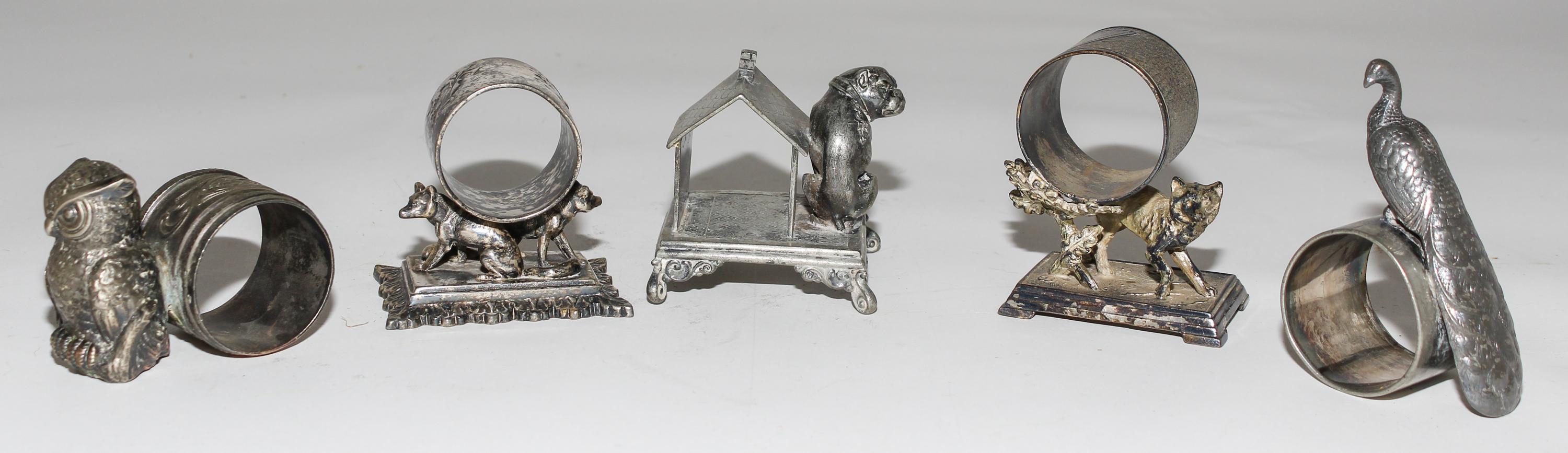 Five Silver-Plate Figural Napkin Rings Height of tallest 3 1/8 inches. — LATE 19TH CENTURY