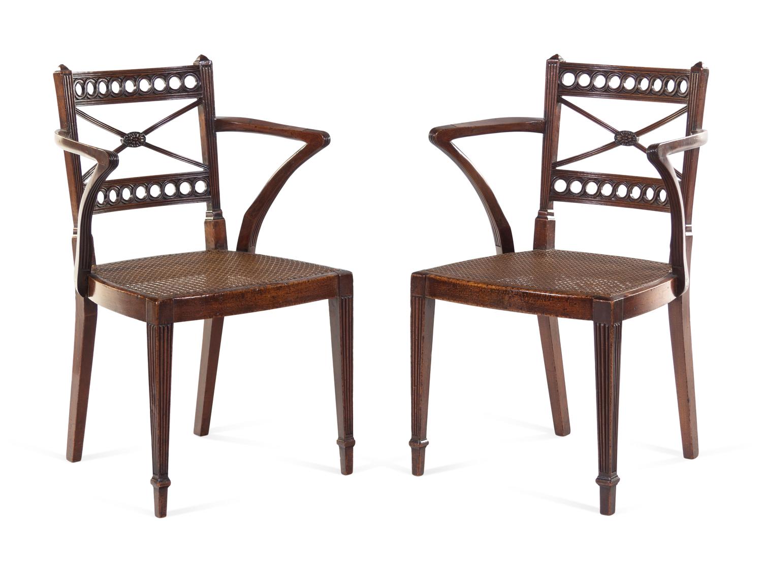 A Pair of Regency Carved Mahogany Cane Upholstered Armchairs