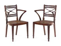 A Pair of Regency Carved Mahogany Cane Upholstered Armchairs