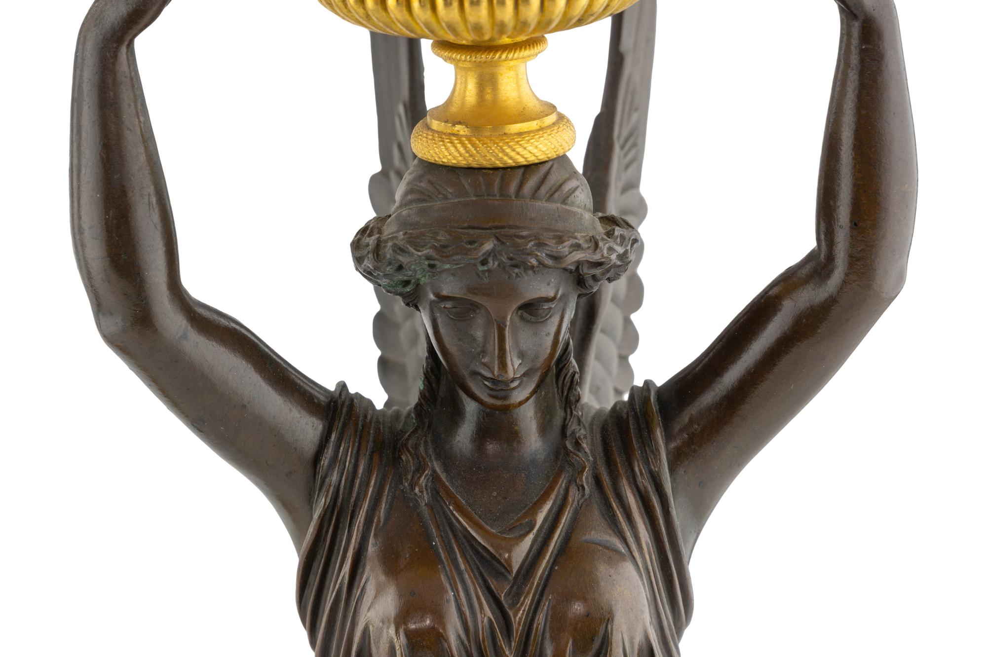 A Pair of Empire Gilt and Patinated Bronze Four-Light Candelabra