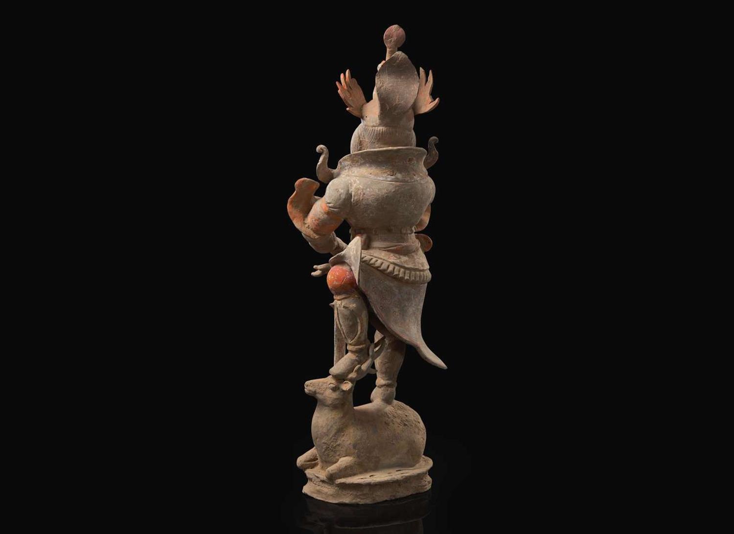 A Chinese painted and parcel-gilt pottery guardian, Tang dynasty 彩繪漆金陶俑天王 唐