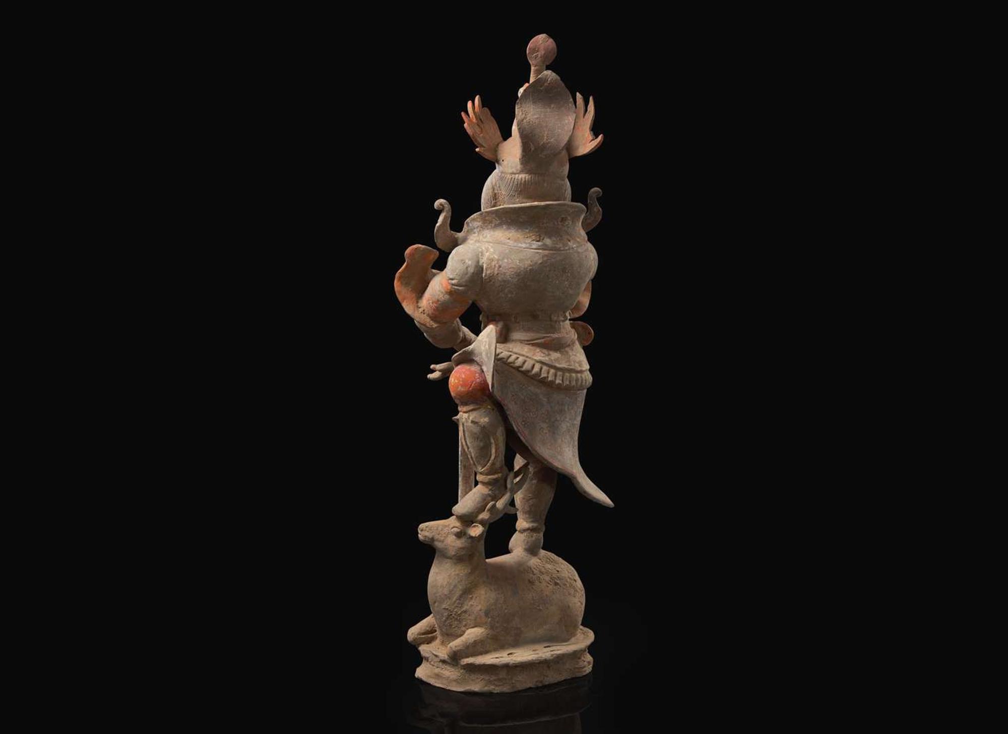 A Chinese painted and parcel-gilt pottery guardian, Tang dynasty 彩繪漆金陶俑天王 唐