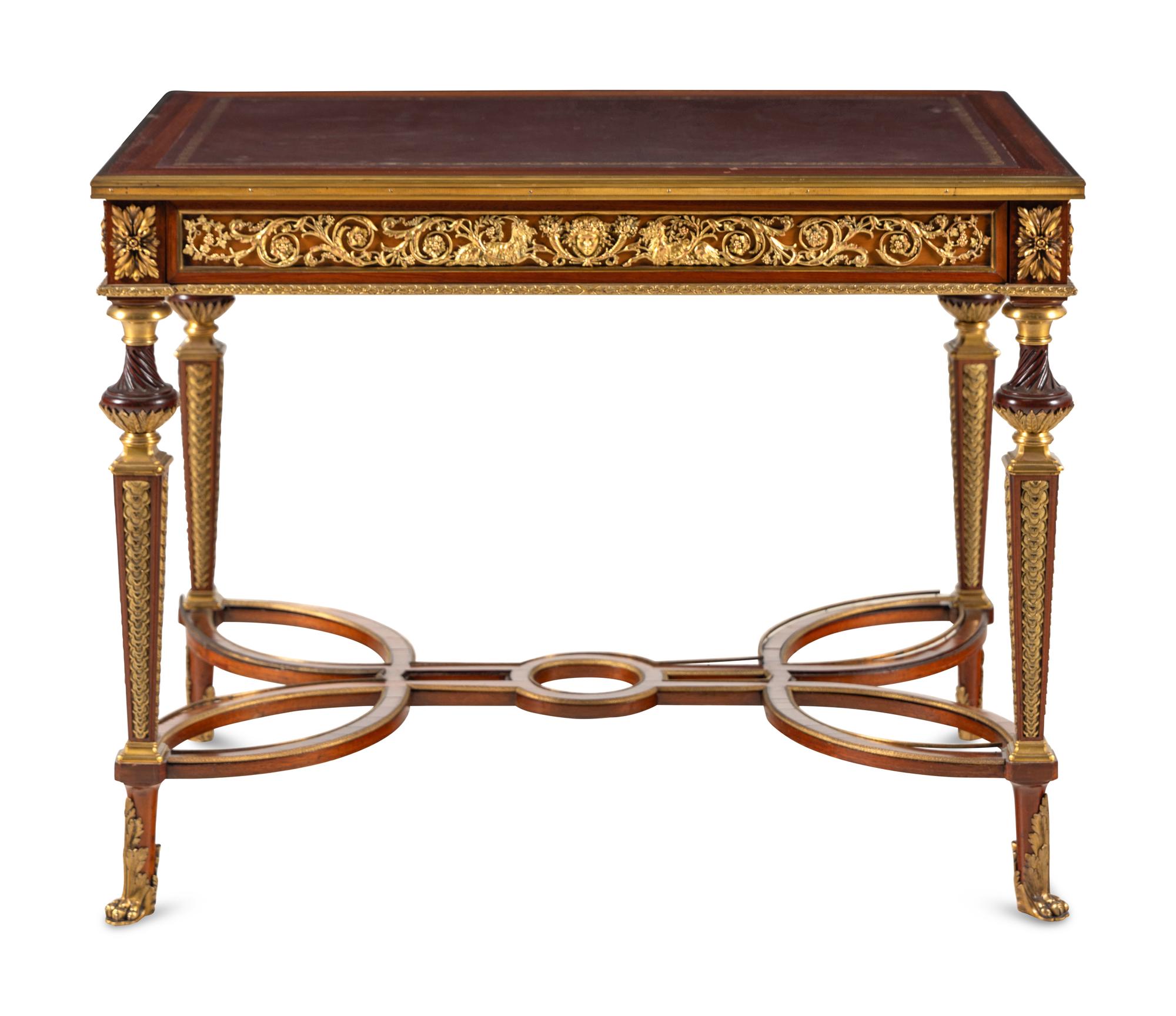 A Louis XVI Style Gilt Bronze Mounted Mahogany Writing Table
