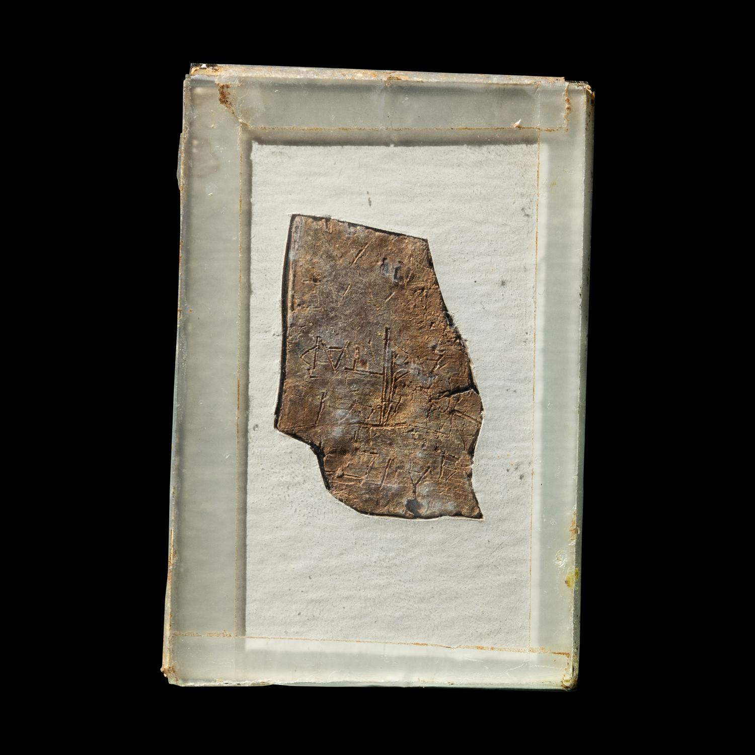 A Roman Lead Fragment with Greek Inscription