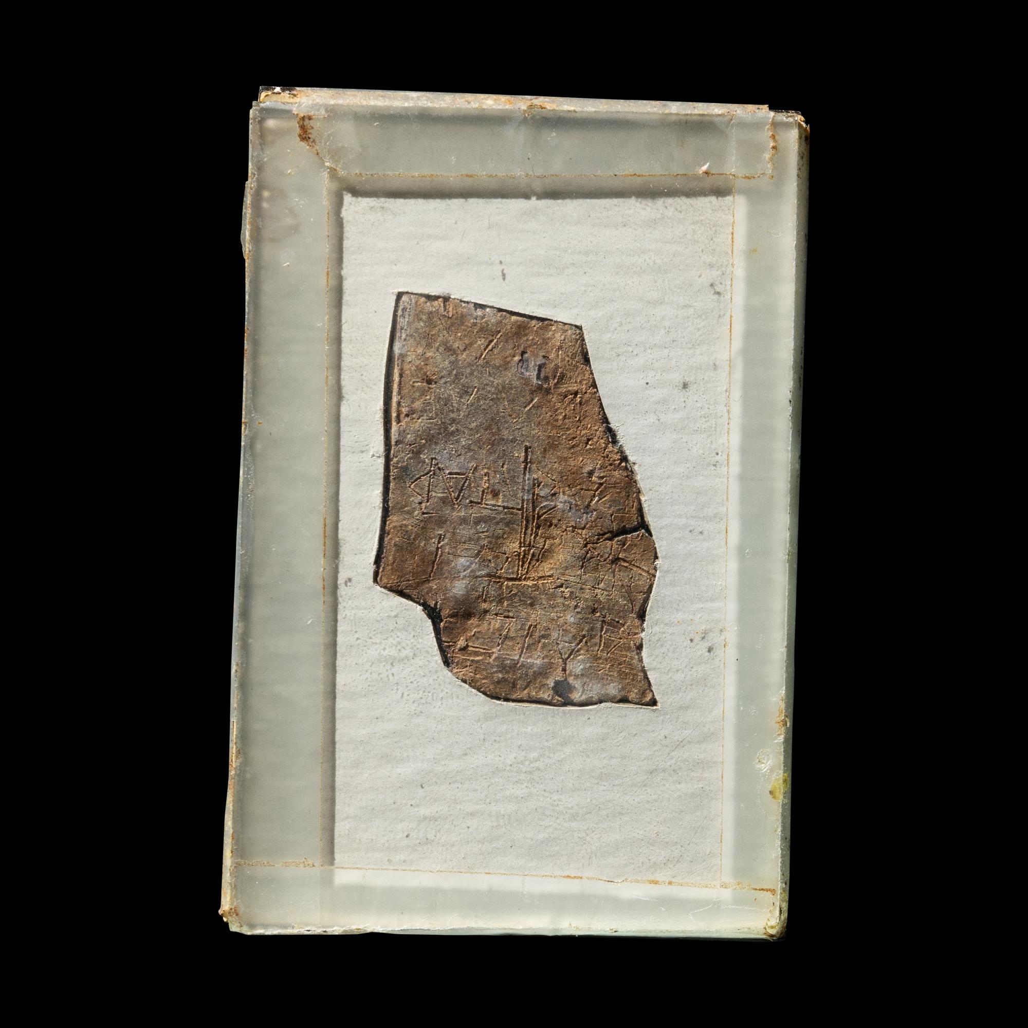 A Roman Lead Fragment with Greek Inscription