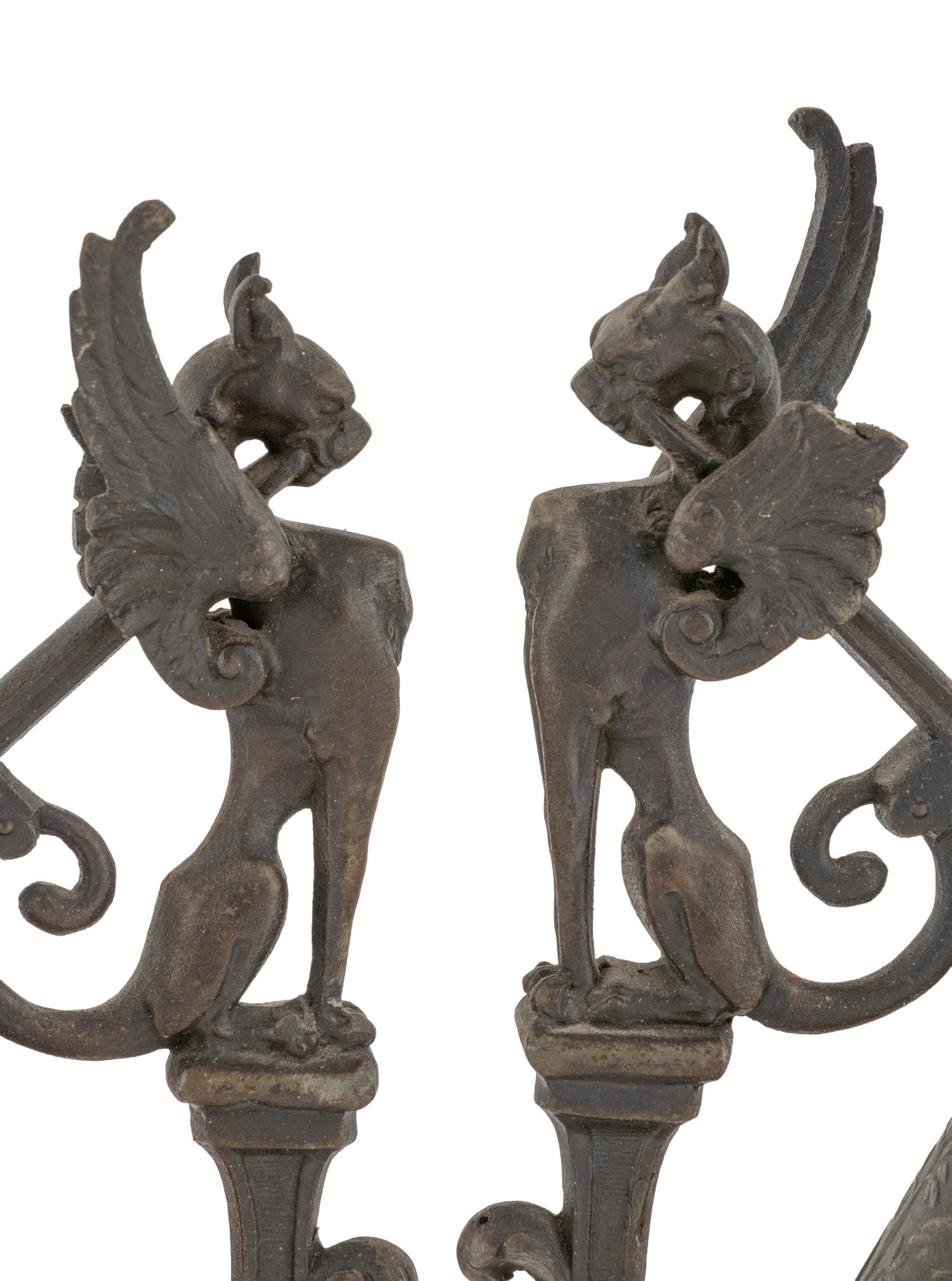 A Pair of Neoclassical Cast Metal Candlesticks