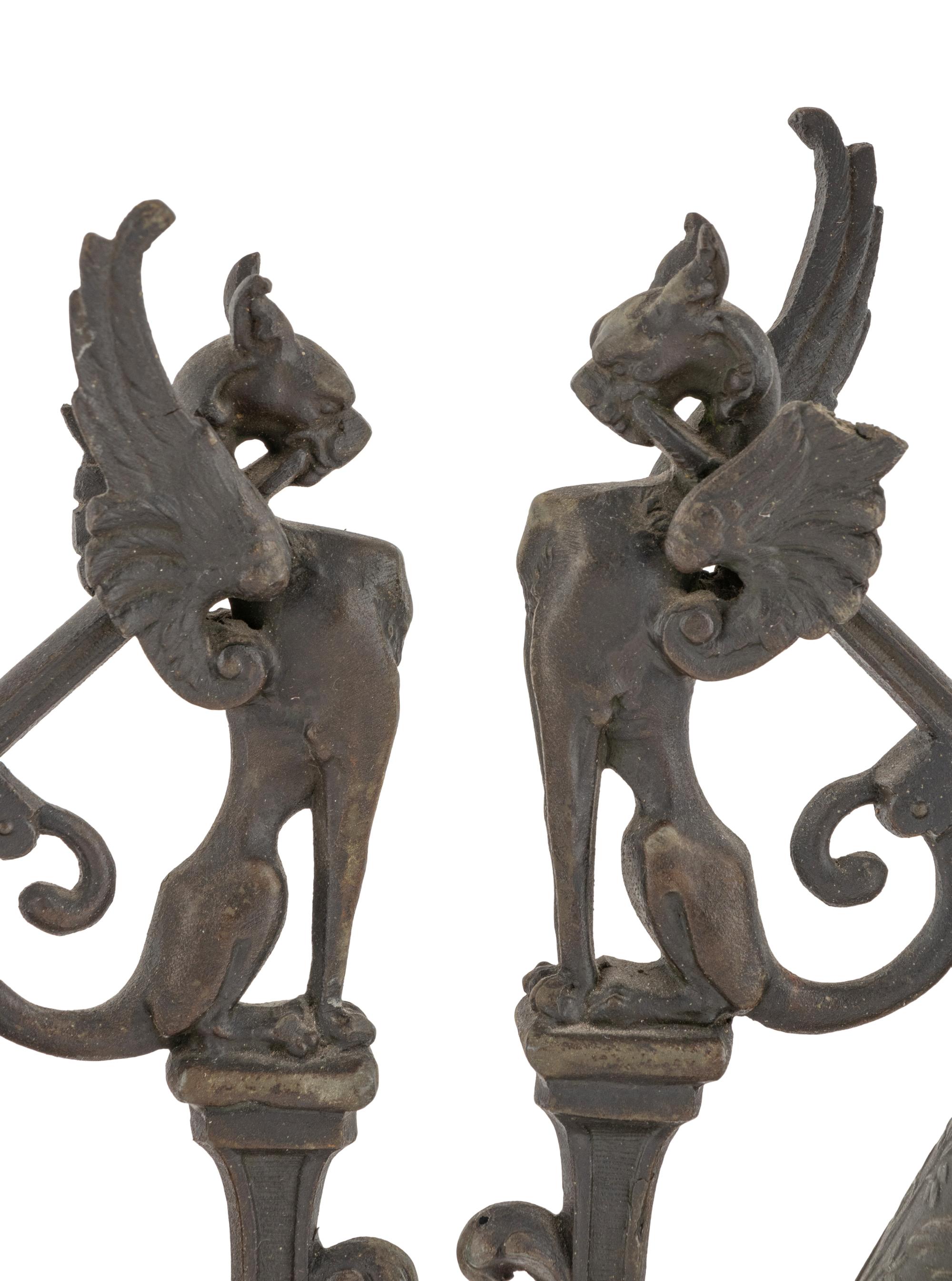 A Pair of Neoclassical Cast Metal Candlesticks