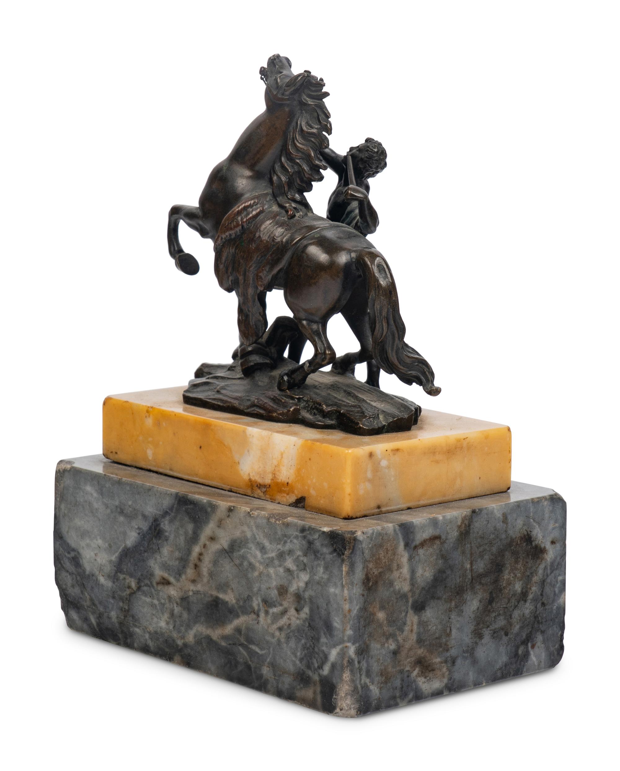 A Bronze Group of a Marly Horse with Attendant