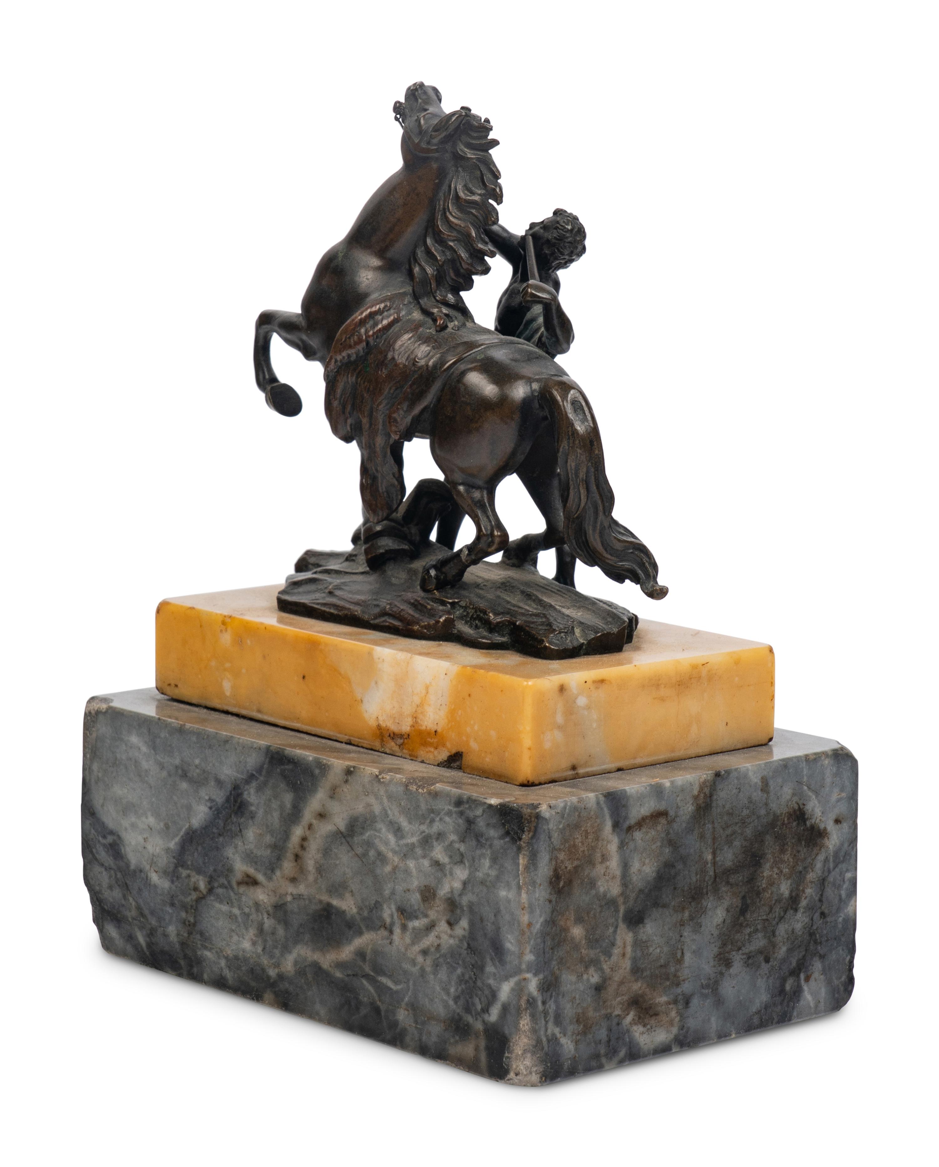 A Bronze Group of a Marly Horse with Attendant