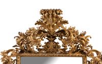 A Large Italian Baroque Style Carved Giltwood Mirror