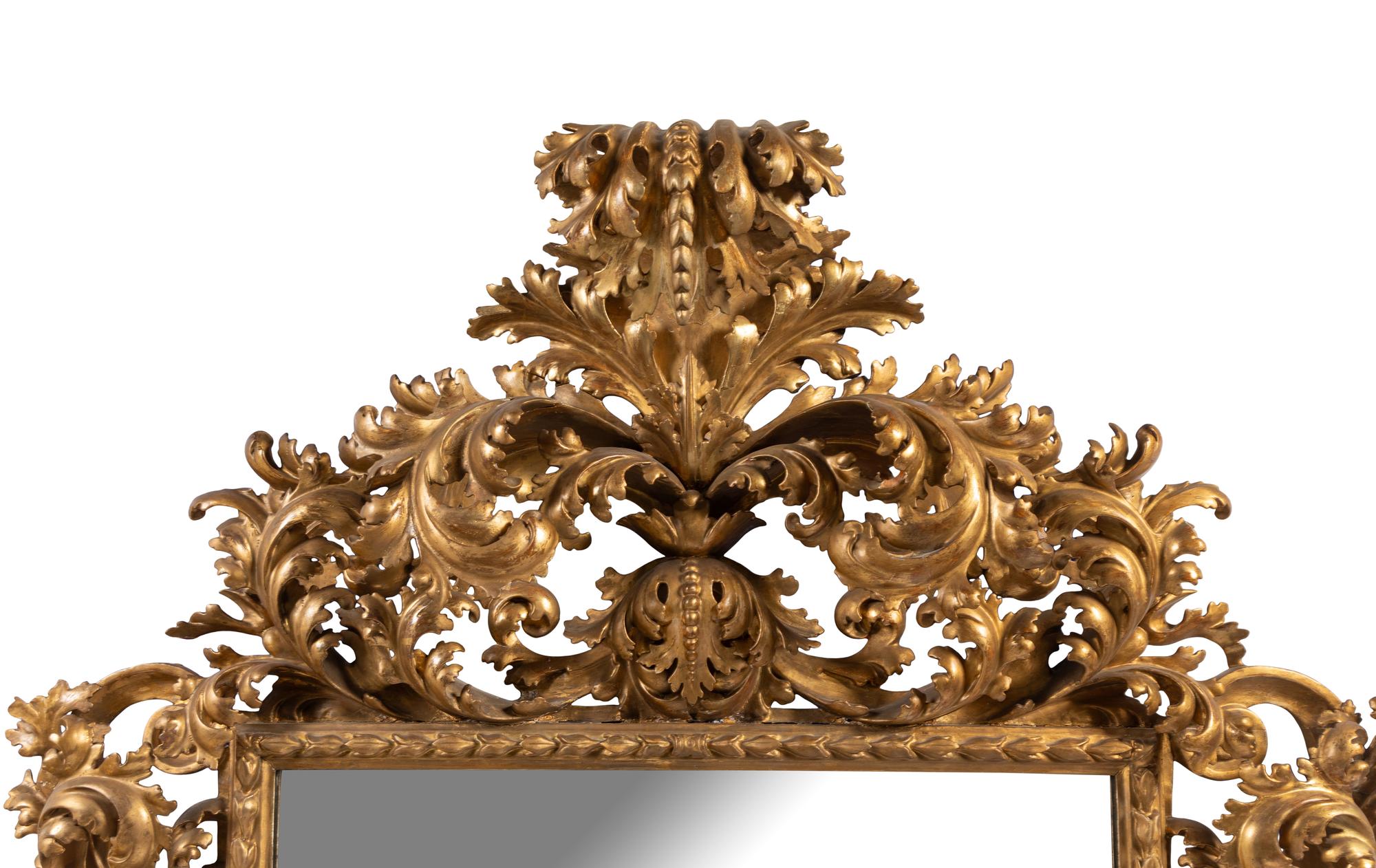 A Large Italian Baroque Style Carved Giltwood Mirror