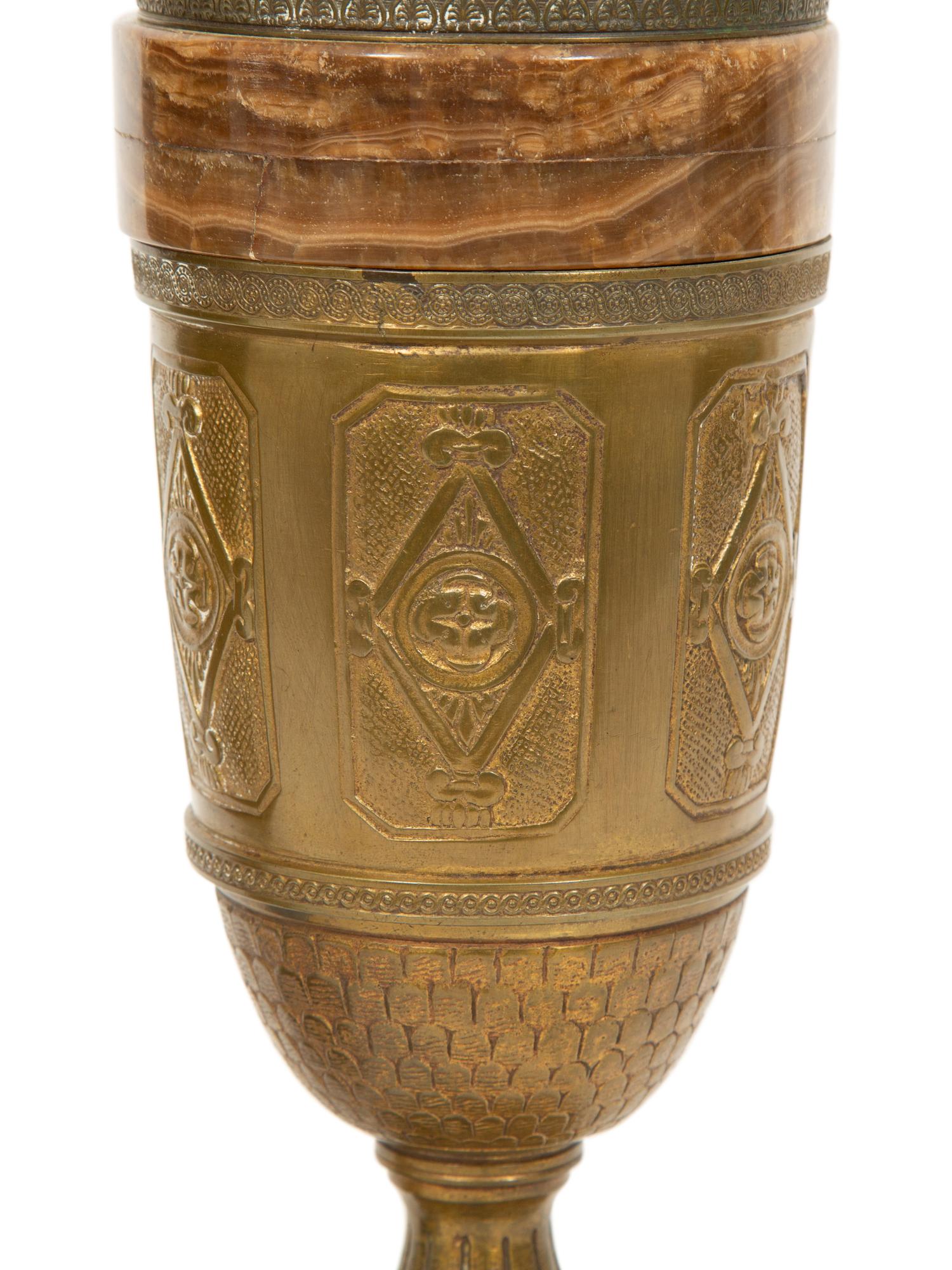 A Pair of Continental Gilt Bronze and Onyx Urns