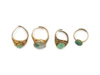 Four Chinese Silver-Gilt Mounted Jadeite Rings