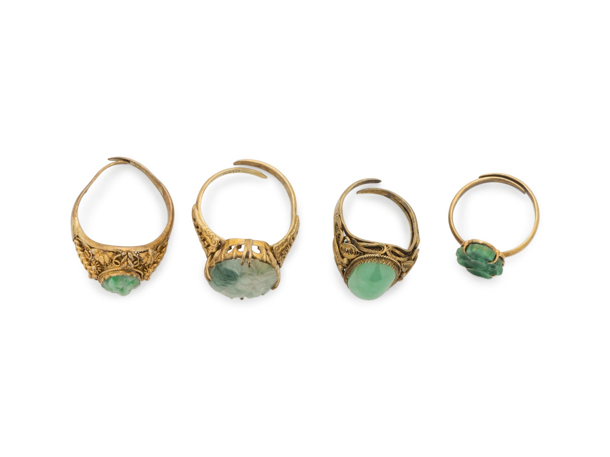 Four Chinese Silver-Gilt Mounted Jadeite Rings