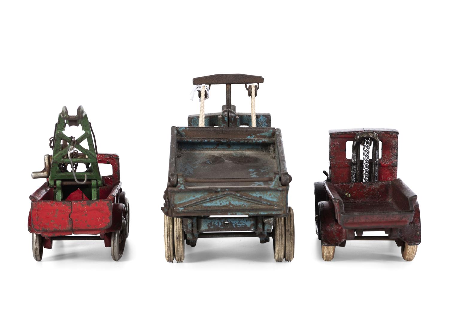 Three Arcade Painted Cast Iron Toy Trucks