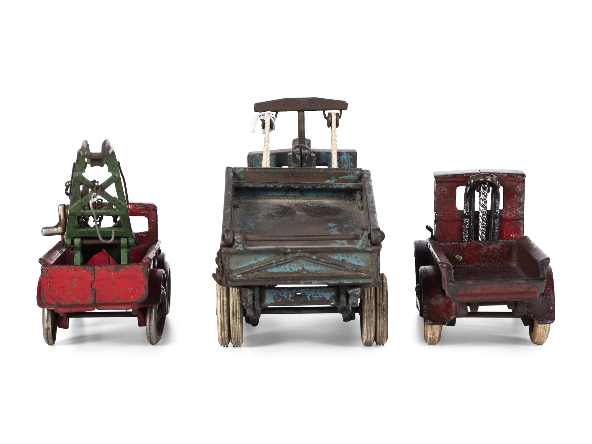 Three Arcade Painted Cast Iron Toy Trucks