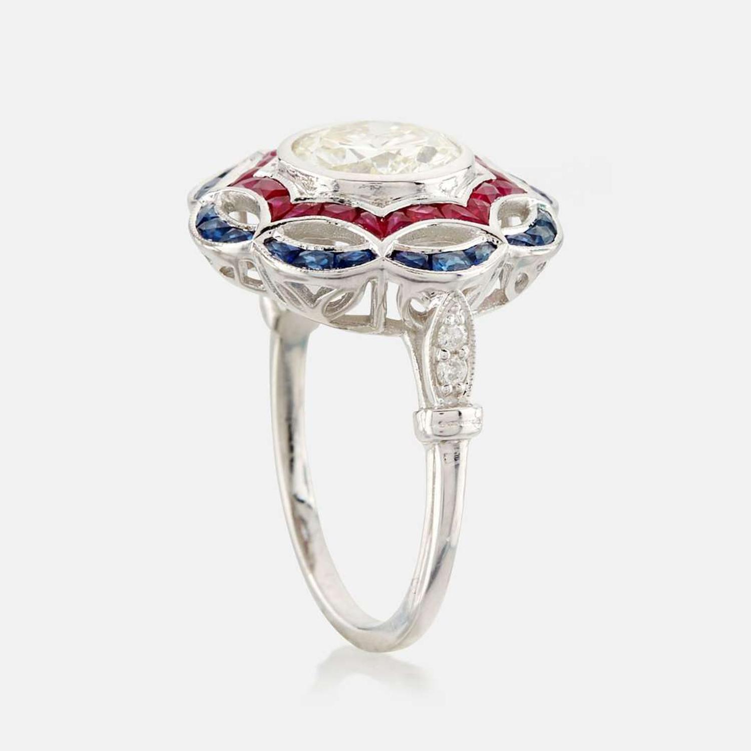 A diamond, ruby, sapphire, and white gold ring