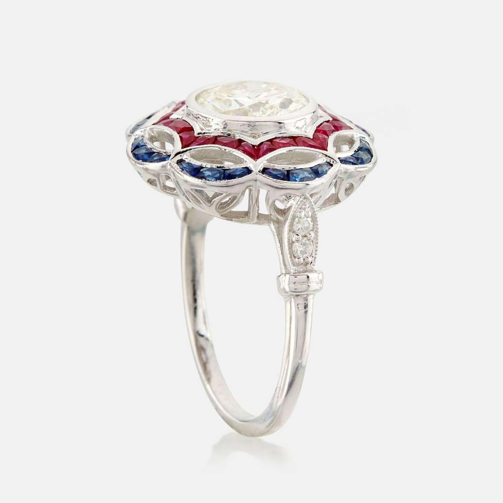 A diamond, ruby, sapphire, and white gold ring
