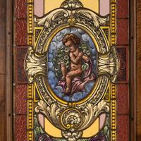 A French Carved Walnut and Leaded Glass Double-Door Portal