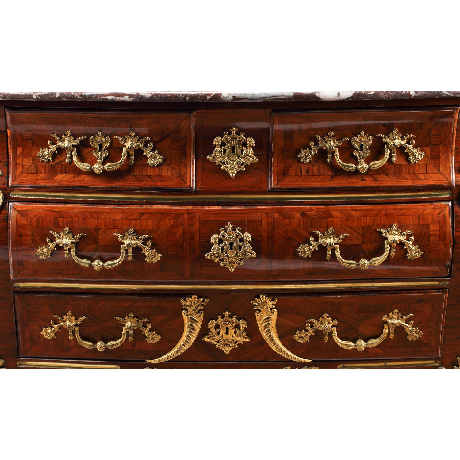 A Régence Gilt Bronze Mounted Marquetry Marble-Top Commode